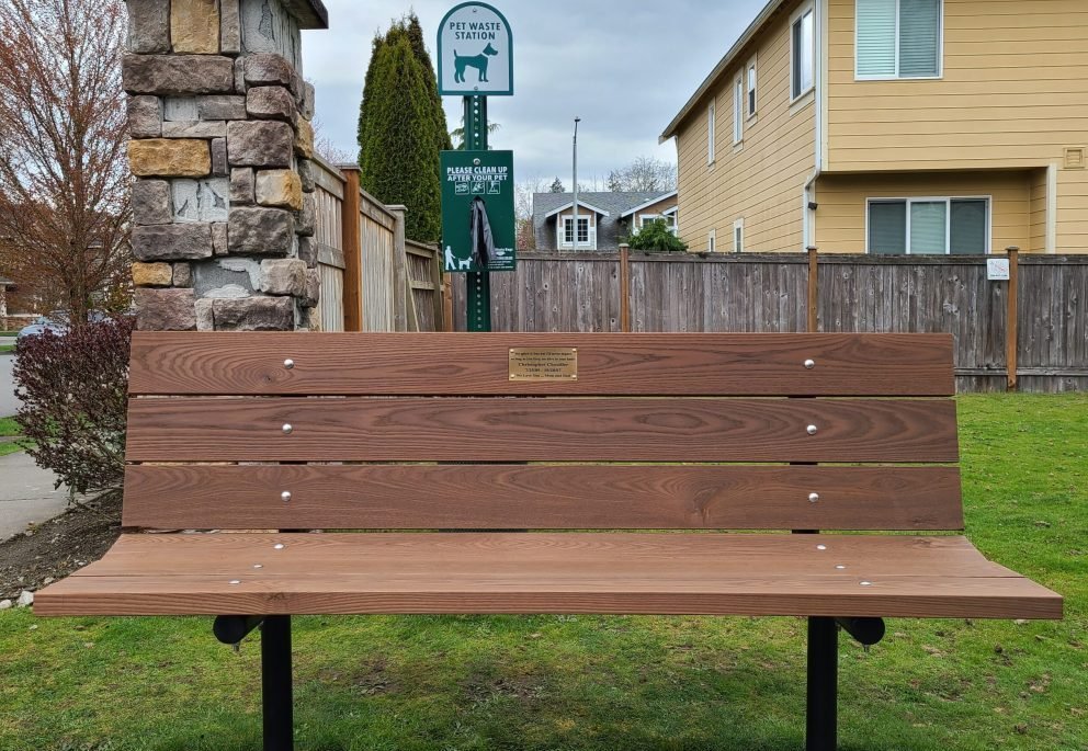 Complete Public Amenity Installation Miami | Benches, Waste Stations & More Runika.pro installation team setting up both a park bench and a nearby pet waste station as part of a complete site amenity upgrade in Miami