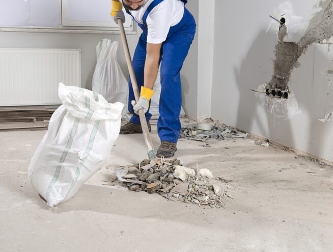 A clean and clear construction site in Miami after professional debris removal by Runika.pro, showing a swept concrete slab ready for the next phase