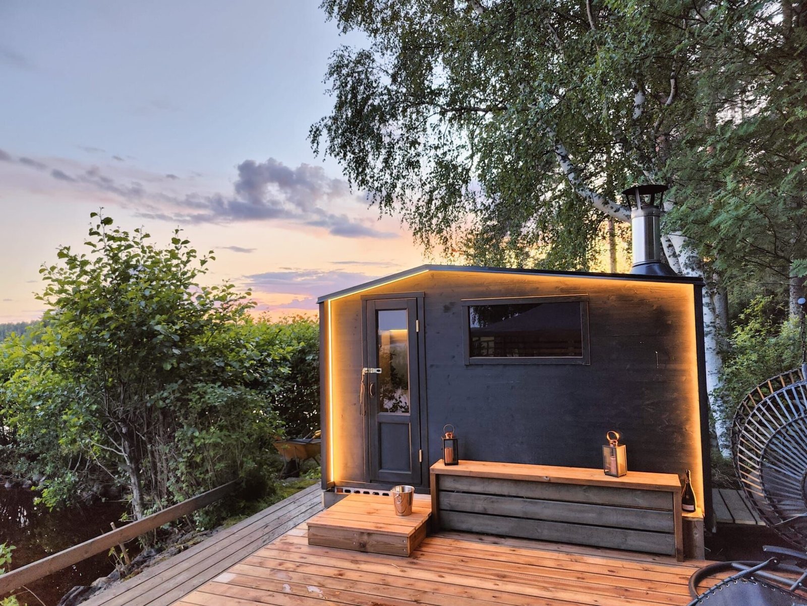 Runika.pro team completing the final steps of a mobile sauna installation, including steps and exterior lighting, for a Miami client