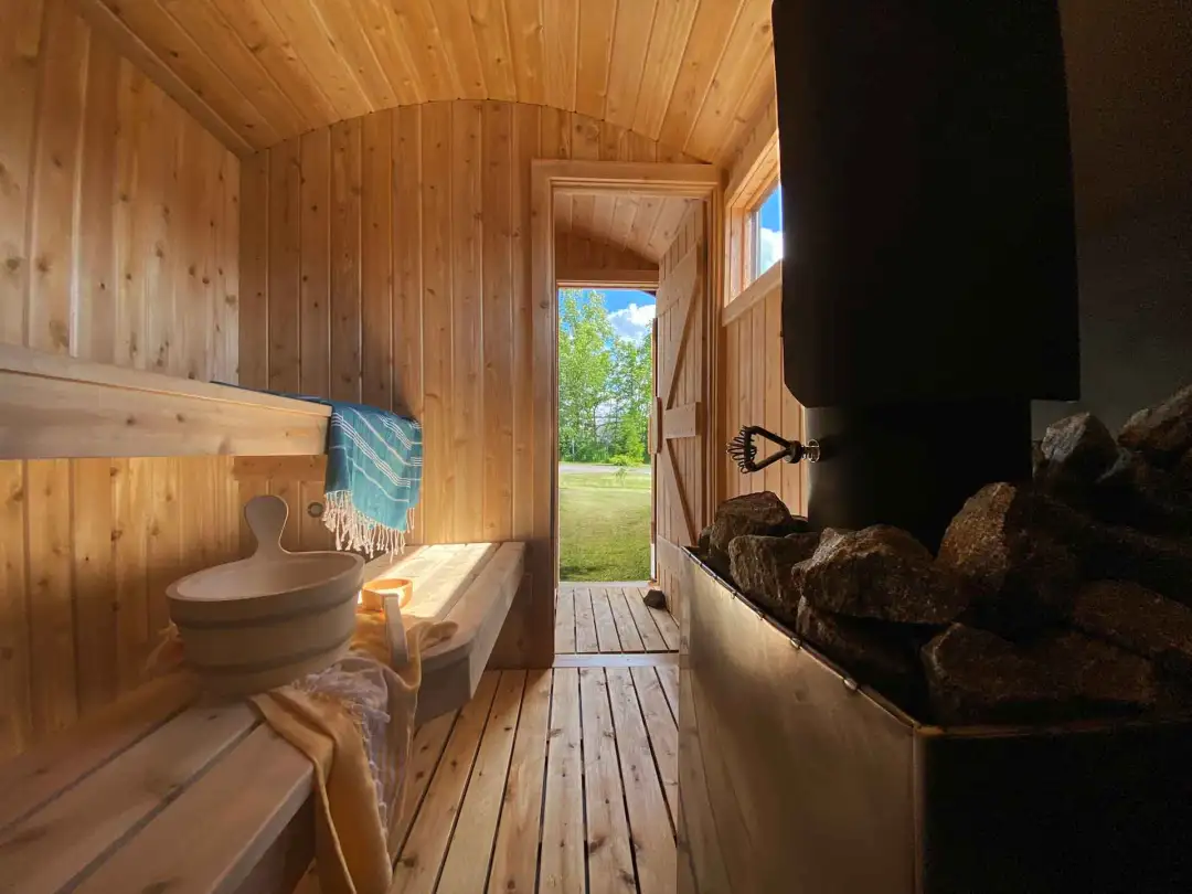 A stylish, compact mobile sauna set up by Runika.pro for a special event, wedding, or rental experience at a Miami venue or private home