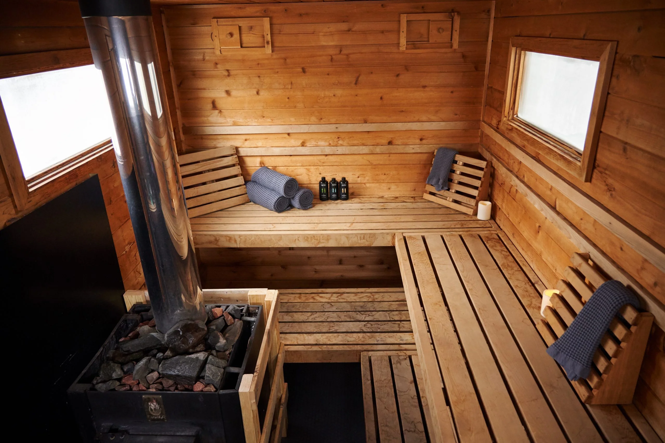 A modern infrared or traditional wood-fired mobile sauna, fully installed and operational on a residential property in Miami by Runika.pro