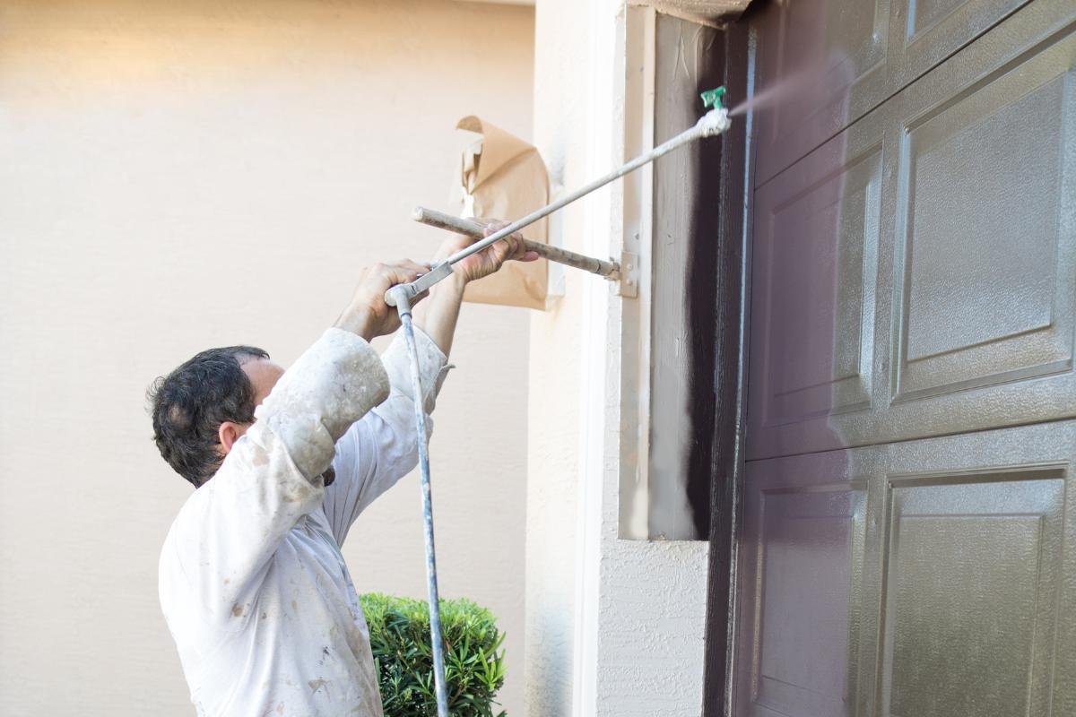 Front Door Painting Services Miami | Expert Detail & Finish | Runika.pro A Runika.pro painter in Miami applying a precise, smooth finish to a home's front door, enhancing curb appeal and protection