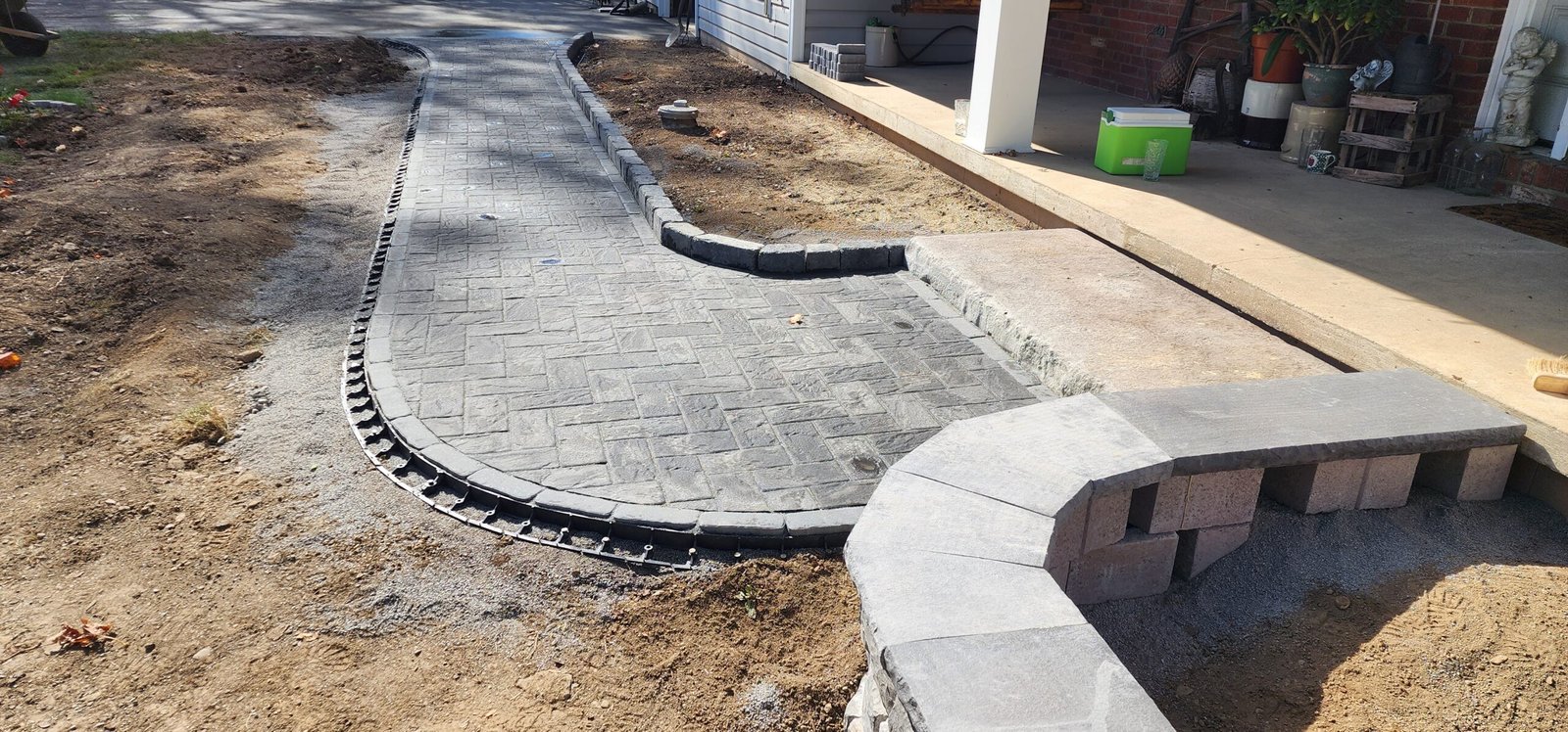 How We Build: Quality Paver & Sidewalk Installation in Miami Close-up of the paver installation process by Runika.pro technicians in Miami, ensuring proper spacing and pattern alignment