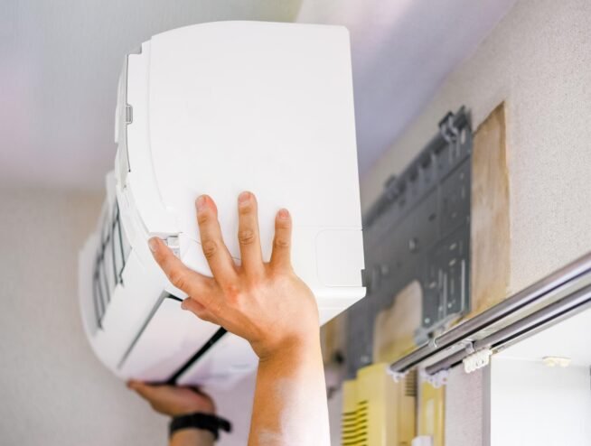 Runika.pro HVAC technicians in Miami performing a precise installation of a new high-efficiency central air conditioning system