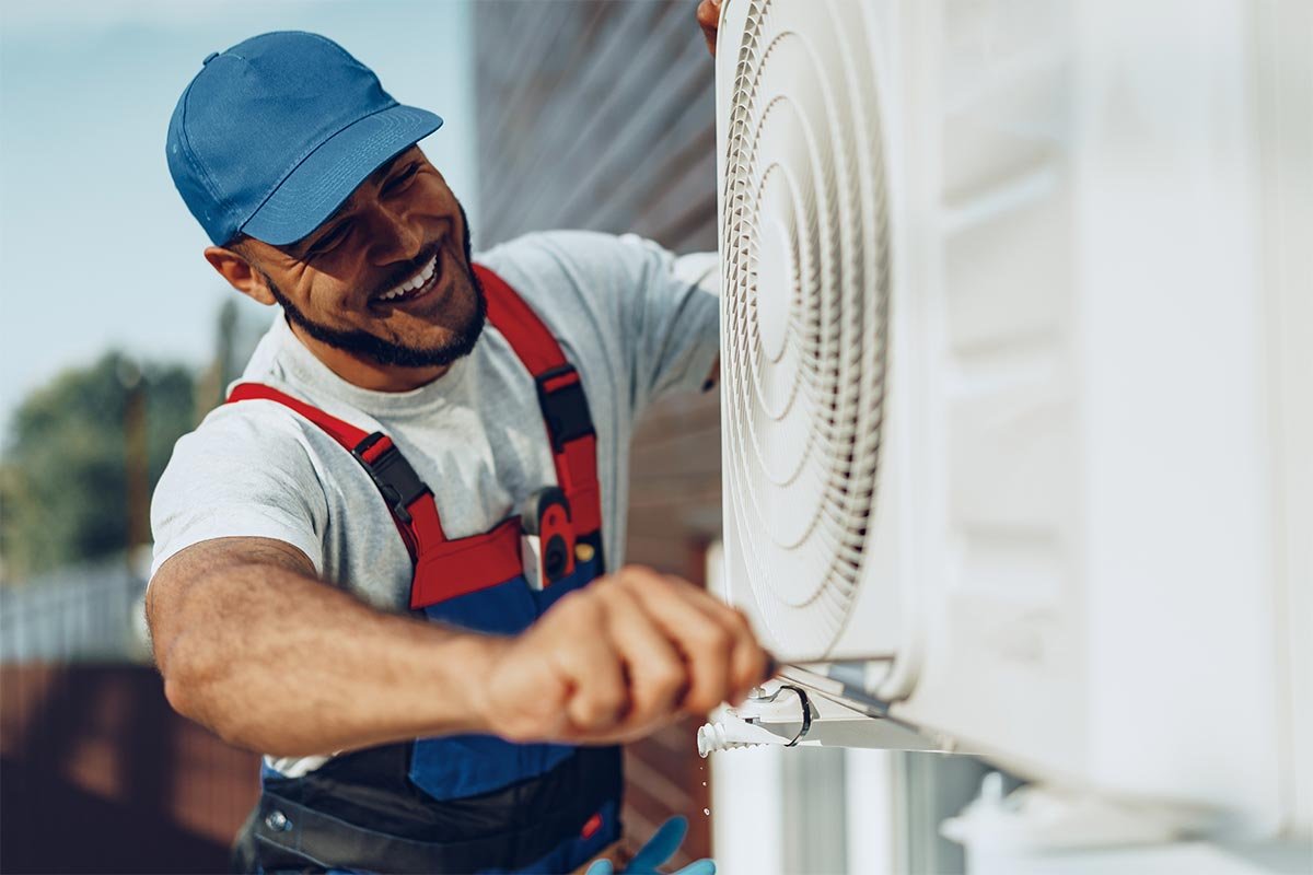 24/7 Emergency AC Repair Miami | Fast Service When You Need It Most | Runika.pro A Runika.pro HVAC technician in Miami performing an urgent repair on a broken air conditioner unit during a hot day