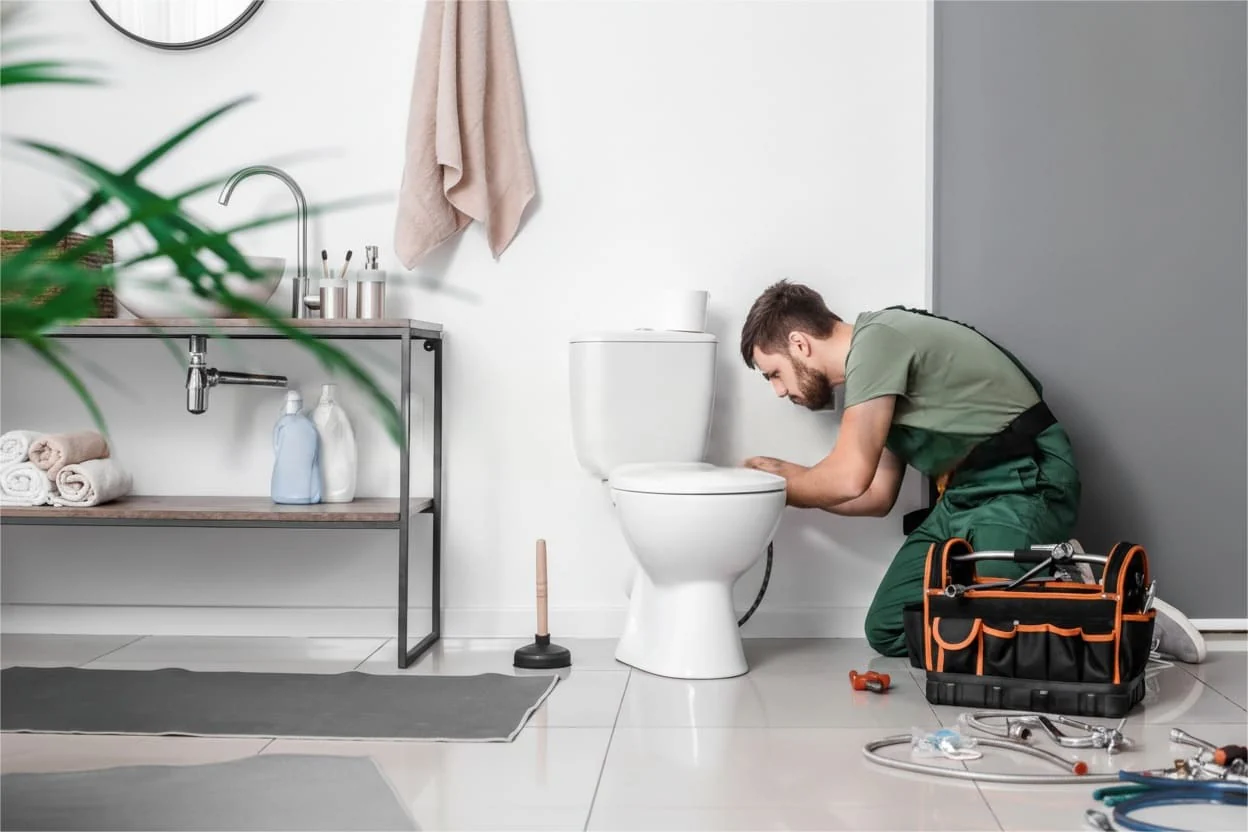 Plumbing Fixture Repair Miami | Stop Leaks & Drips | Fast & Reliable Runika.pro technician skillfully repairing a dripping faucet or replacing a worn-out cartridge under a sink in a Miami home